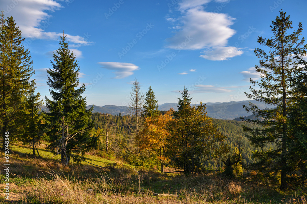 Beautiful autumn landscape in mountains and blue sky with clouds Beautiful autumn landscape in mountains and blue sky with clouds