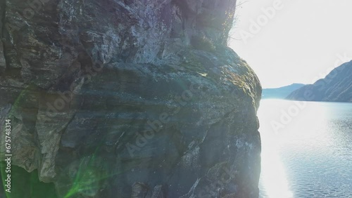 Downward aerial reveal of decommisioned railway tunnel at Hetteneset in Stanghelle, Norway photo