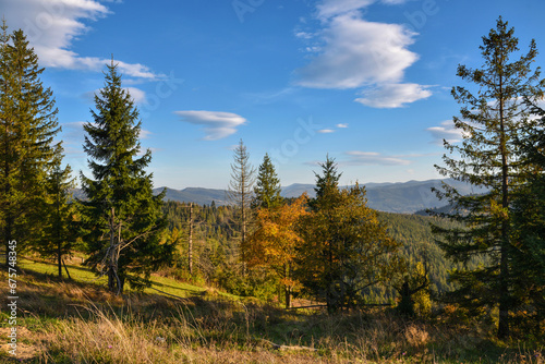 Beautiful autumn landscape in mountains and blue sky with clouds