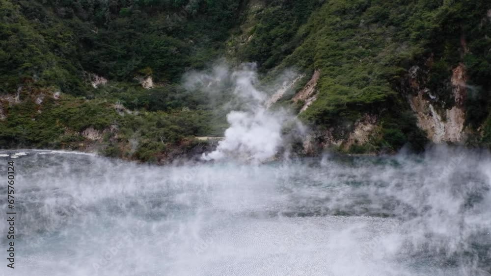 Clouds of hot steam drifting over sulphuric hot pool of Frying Pan Lake in Waimangu Volcanic Rift Valley, Rotorua, New Zealand Aotearoa Clouds of hot steam drifting over sulphuric hot pool of Frying Pan Lake in Waimangu Volcanic Rift Valley, Rotorua, New Zealand Aotearoa