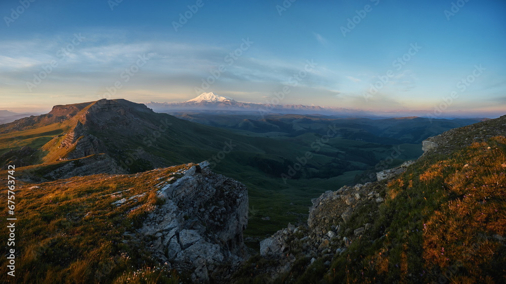 Morning landscape on peaks of Mount Elbrus. Big high mountain covered with snow, Caucasus Mountains, Russia