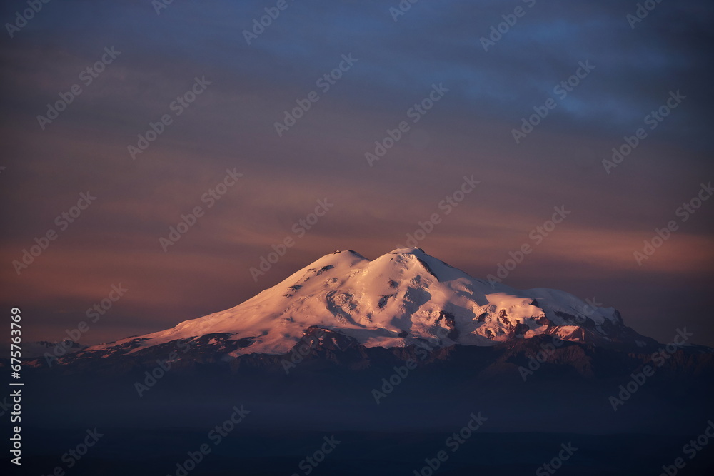 Morning landscape on peaks of Mount Elbrus. Big high mountain covered with snow, Caucasus Mountains, Russia