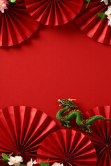 Chinese New Year 2024 - Abstract Lunar New Year Dragon Art on Red Background. Festival Card Design with Folding Paper fans, sakura, dragon