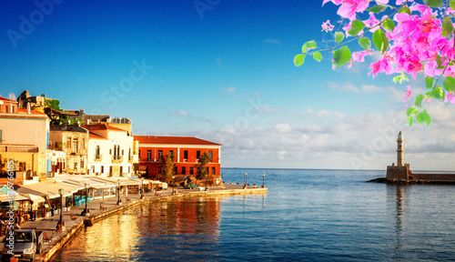 famouse venetian harbour waterfront and lighthouse of Chania old town, Crete, Greece with flowers