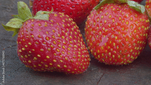 Ripe strawberries on a wooden board
