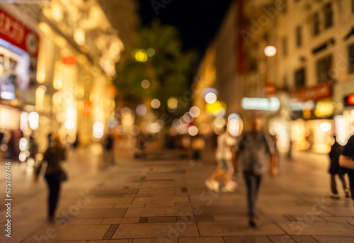 Fototapeta Naklejka Na Ścianę i Meble -  Crowd of anonymous people walking on busy city street at night , urban city life background