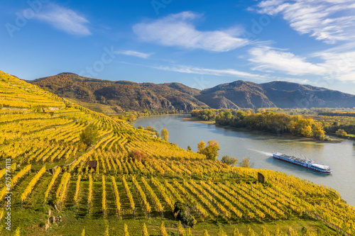 Autumn panorama of Wachau valley (Unesco world heritage site) with ship on Danube river near the Weissenkirchen village in Lower Austria, Austria