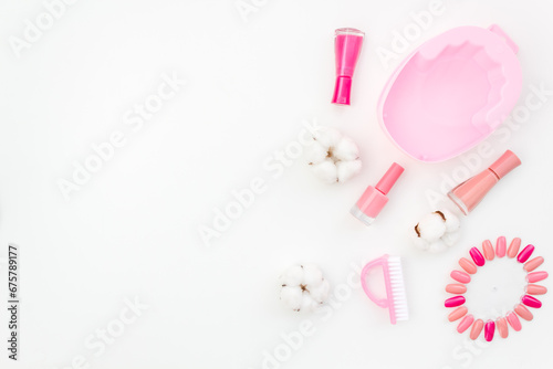 Pink and nude trend colors gel varnishes with manicure and pedicure beauty tools