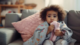 Curly-haired toddler wrapped in a blanket, being ill and sick, home health care