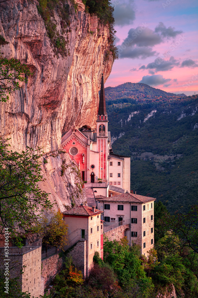 Madonna della Corona, Italy. Aerial image of the unique Sanctuary Madonna della Corona (Sanctuary of the Lady of the Crown) was built in the rock, located in the Alps in Italy at autumn sunrise.