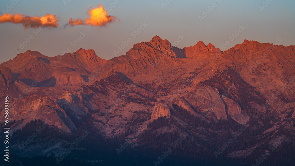 The Sierra Nevada mountains illuminated by a strong sunset light.