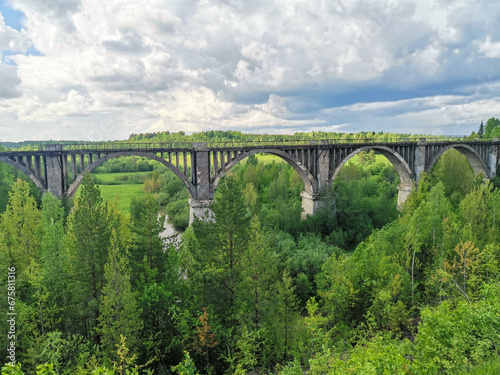 Railway bridge across the river in the south of the Kama region. The old Big Sars viaduct. The abandoned Oktyabrsky viaduct in the Perm Region. Russia. © Виктория Балобанова