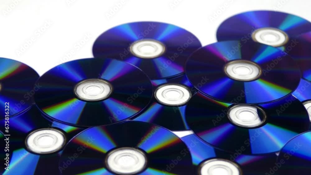 Closeup video of blue compact discs isolated on a white background Closeup video of blue compact discs isolated on a white background