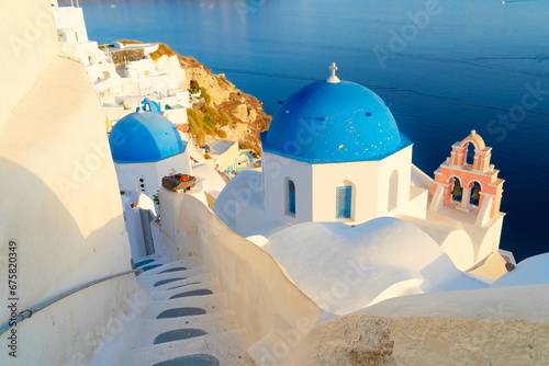 traditional greek village Oia of Santorini, with blue domes against sea and caldera, Greece, close up view