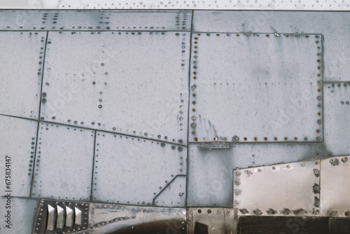 Metal old airplane skin, fuselage with rivets military background