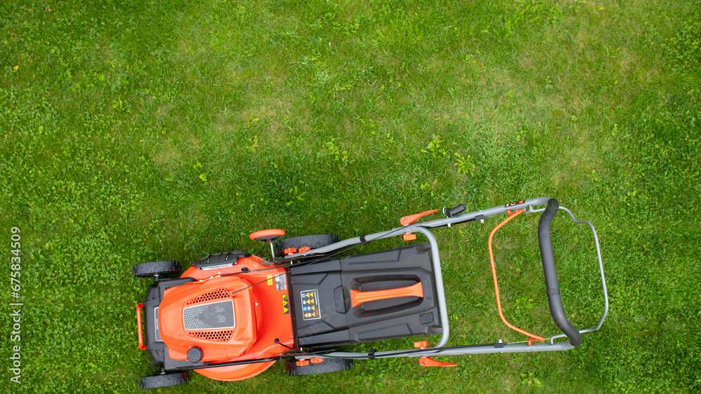 self-propelled lawn mower in the garden self-propelled lawn mower in the garden