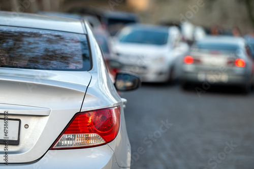 car in big traffic jam. Back view. Blurred background.