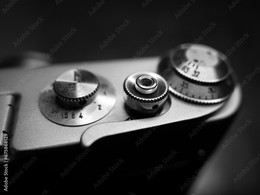Grayscale shot of the small parts of an old vintage camera Grayscale shot of the small parts of an old vintage camera