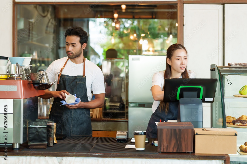 cafe owner multiracial male business couple cleaning coffee cups coffee maker Asian girlfriend checking orders store closed credit card swipe machine paper coffee cups attentively cafe small business. - obrazy, fototapety, plakaty 