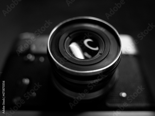 Grayscale shot of the small parts of an old vintage camera