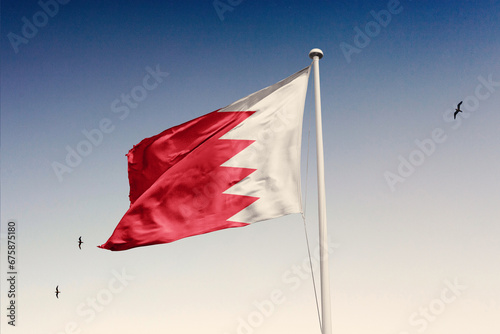 Bahrain flag fluttering in the wind on sky.