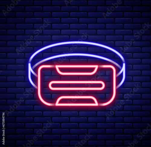 Glowing neon line Virtual reality glasses icon isolated on brick wall background. Stereoscopic 3d vr mask. Optical head mounted display. Colorful outline concept. Vector