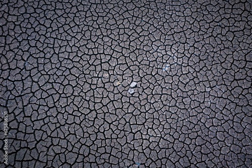 Arid, cracked gray desert landscape surface