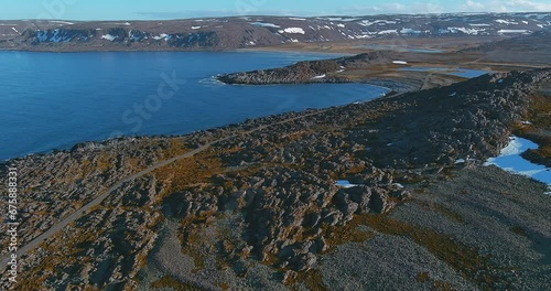 Aerial view of coast road 8100 to Hamningberg with rocky landscape in sunny summer weather, Varanger Peninsula, Norway. photo