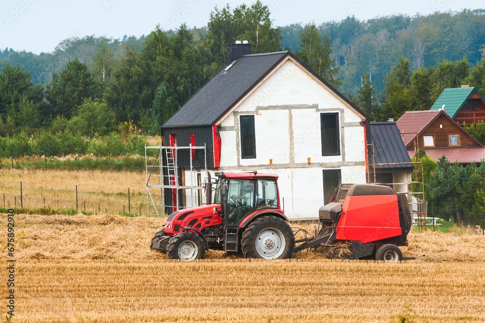 Fototapeta premium Agricultural Industry in Action. Wheat Harvesting on the Farmland. Combine Harvester at Work in the Golden Field.