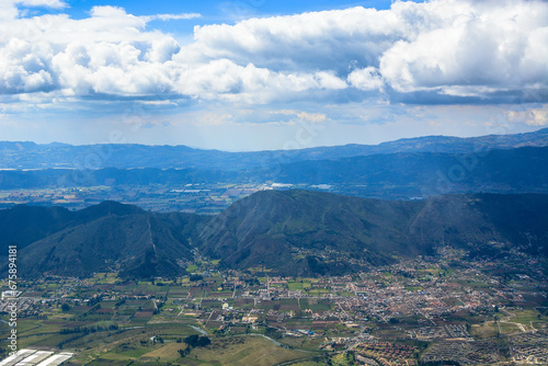 Colombian town of Paipa in Boyaca region, travel destination, natural light background copy space image, mountain range small town