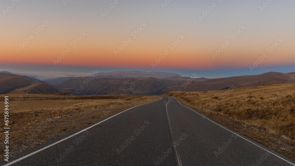 Scenic road in the mountains at sunset