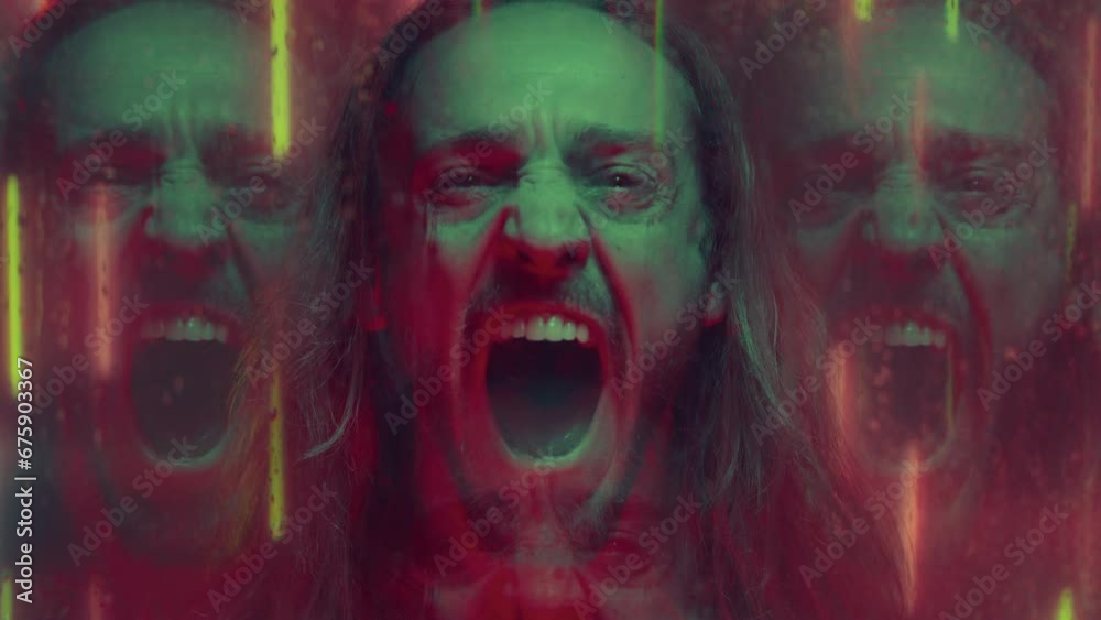 Angry and frustrated man with long hair screaming in rage at camera, standing behind wet window in studio with neon lights. Video portrait, kaleidoscope effect