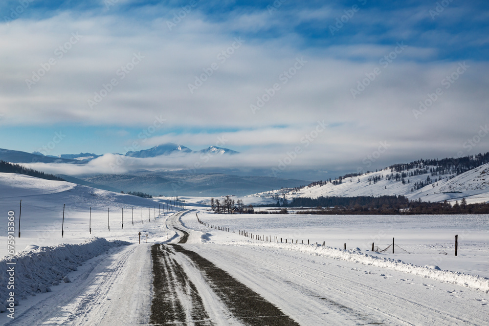 Winter road in the Altai mountains. Gorny Altai, Russia