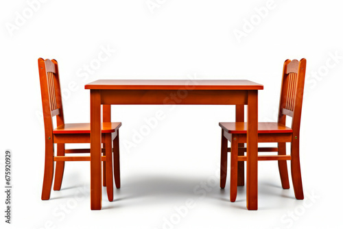 Wooden table and two chairs with white background behind them.