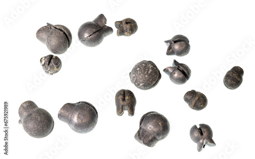 A collection of pinch style split shot lead fishing weights on a clean background. photo