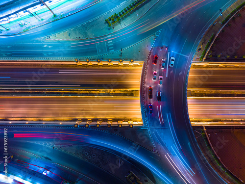 Expressway top view, Road traffic an important infrastructure, Drone aerial view fly in circle, traffic transportation, Public transport or commuter city life concept of economic and energ, transport. photo