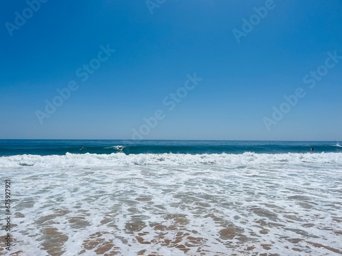 Beautiful ocean coast  waved ocean  surfing  clear blue sky