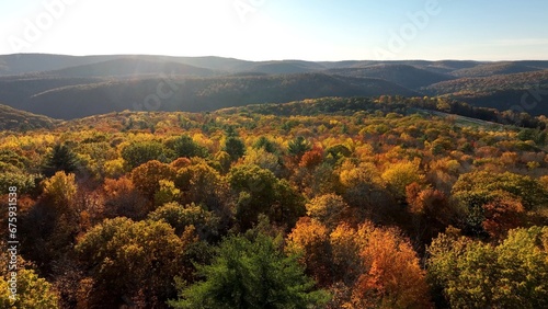 Sunset over mountains, forest and trees in Fall Autumn colors near Pennsylvania Grand Canyon 