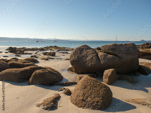 South Africa, Hermanus, Waves crashing on rock formation on beach.
