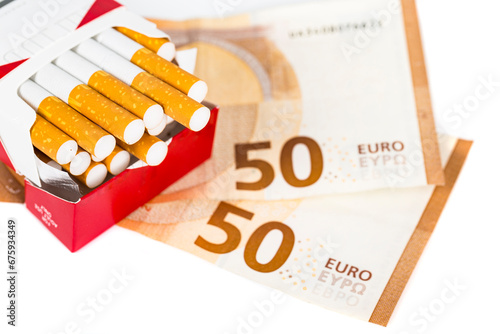 Euros Money notes one hundred and cigarettes box Malboro on white background