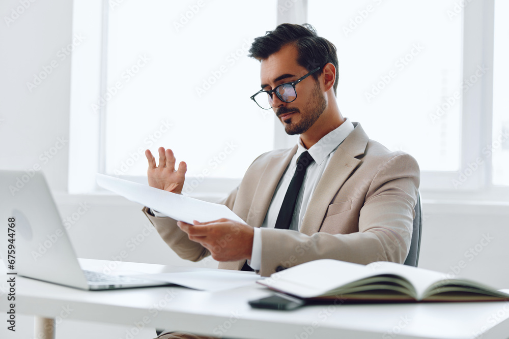 Fototapeta premium Paper office planning businessman holding laptop