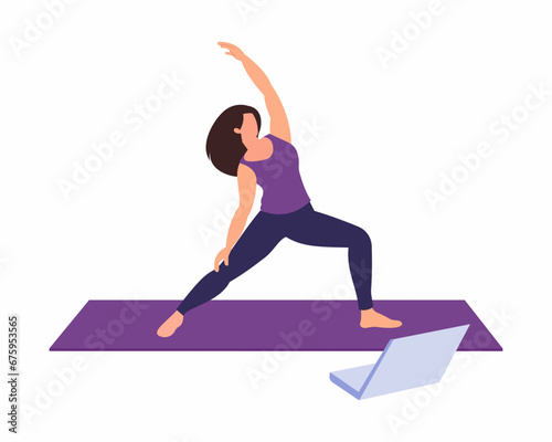 Girl doing online yoga class on laptop sit on mat doing fitness exercise at home Exercise and healthy lifestyle