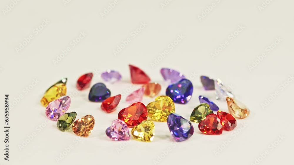 .Beautiful multi-colored heart-shaped diamonds set in a circle..Heart-shaped diamonds in various colors are set on white floor..The sparkling light of diamonds looks charming and beautiful. .Beautiful multi-colored heart-shaped diamonds set in a circle..Heart-shaped diamonds in various colors are set on white floor..The sparkling light of diamonds looks charming and beautiful.