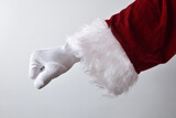 Santa Claus hand with clenched fist upside down wearing.