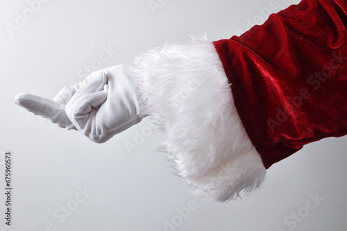 Santa Claus hand rudely showing the middle finger wearing gloves