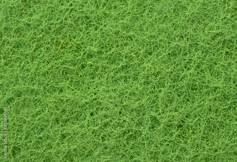 Texture of a sponge for cleaning dishes close-up Texture of a sponge for cleaning dishes close-up