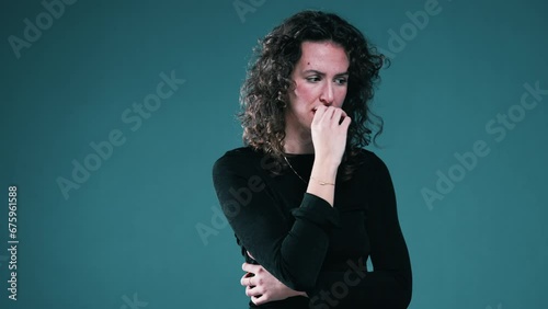 Nervous Person Biting Nails and fidgeting Amid Mental Pressure, woman struggles with anxiety photo