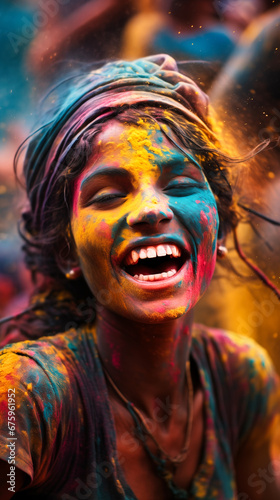 Portrait of Indian Woman With Colored Face Dancing During Holi Festival © Adrian