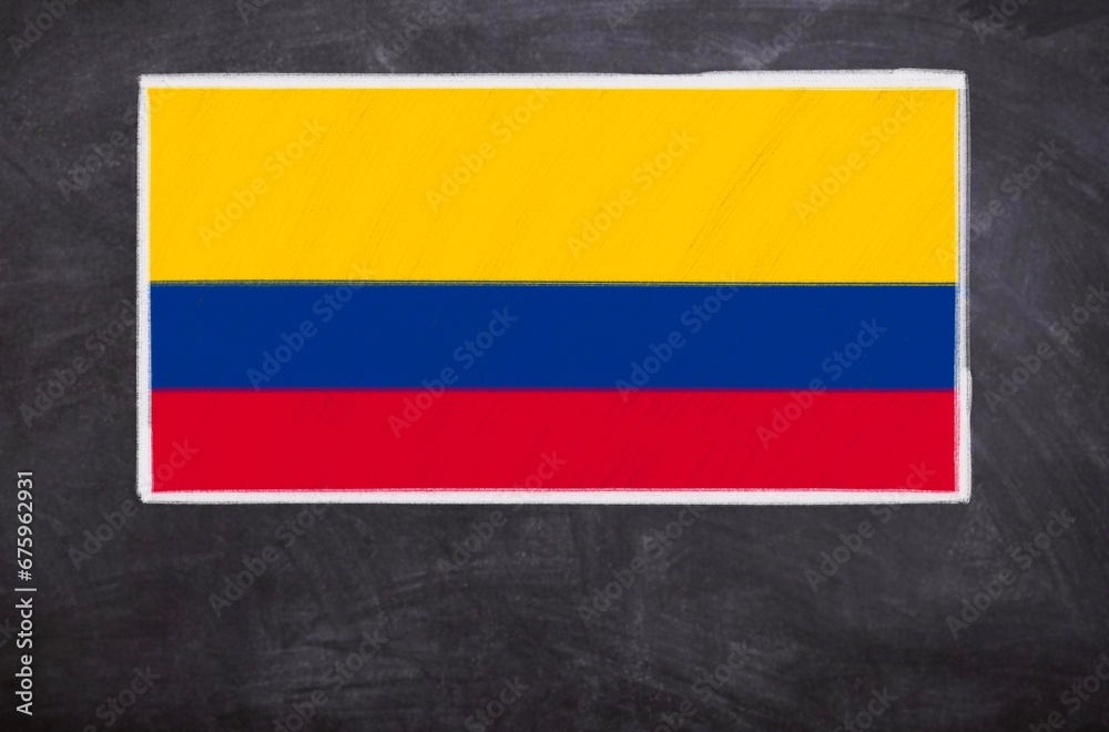 Fototapeta premium Hand drawn flag of Colombia on a black chalkboard