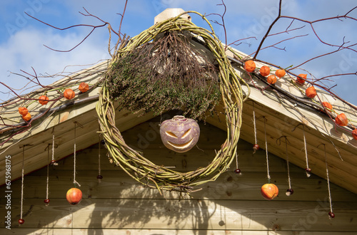 jack o lantern on a wooden building at halloween